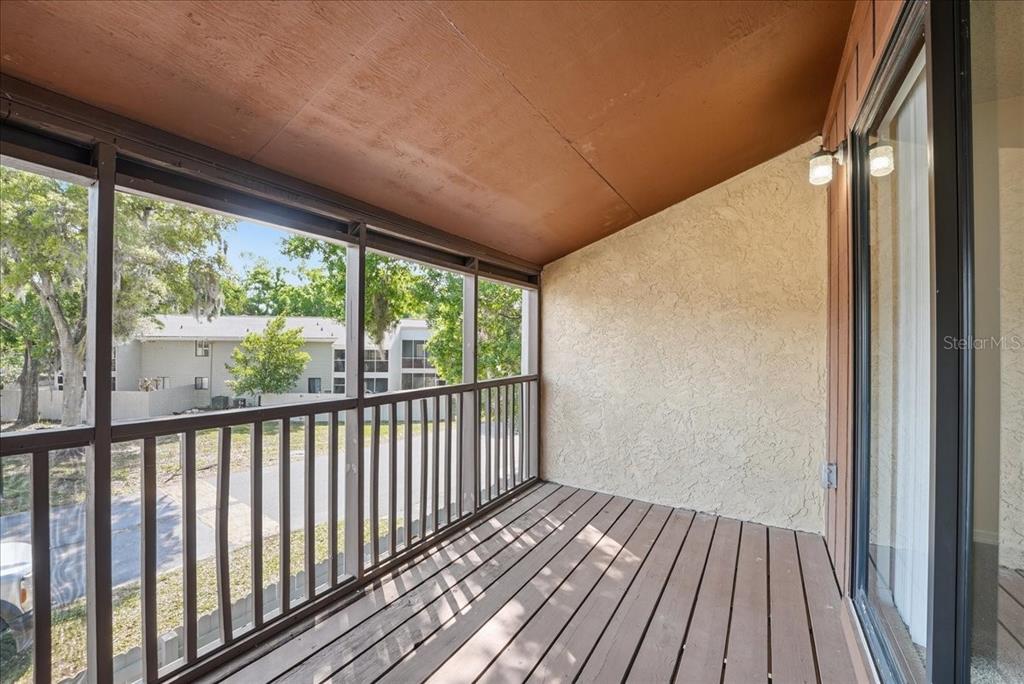 1428 Oak Place, Unit C Apopka, FL 32712 - Photo 8 of 16 a view of balcony with wooden floor
