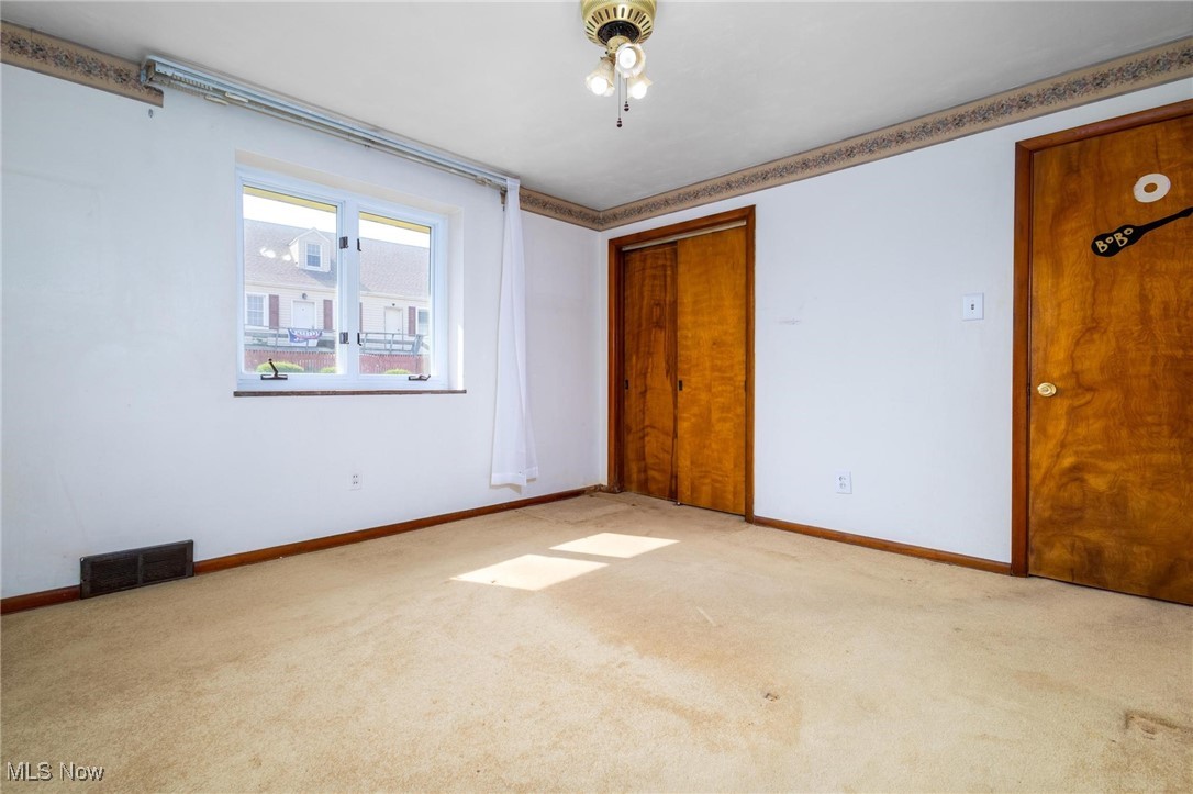 325 Rockdale Road Follansbee, WV 26037 - Photo 31 of 46 Unfurnished bedroom with a closet and light carpet