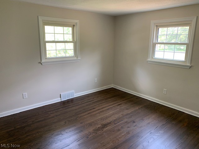38522 Rogers Road Willoughby, OH 44094 - Photo 9 of 9 Unfurnished room featuring dark hardwood / wood-style flooring