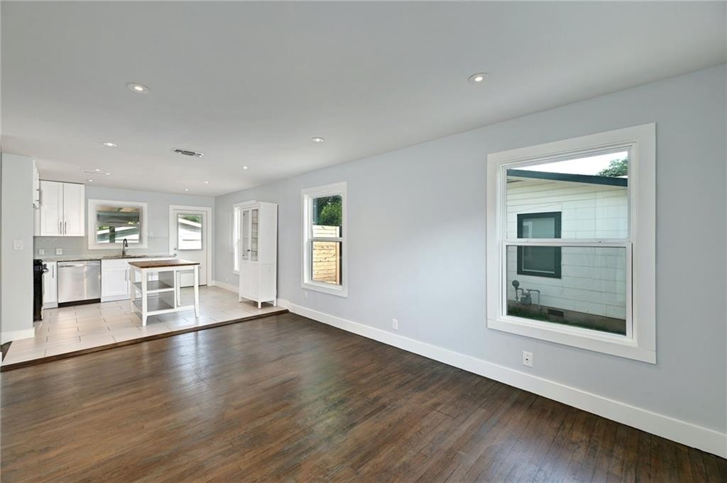 8318 Burrell Drive Austin, TX 78757 - Photo 5 of 27 Unfurnished living room featuring recessed lighting and light wood-style floors