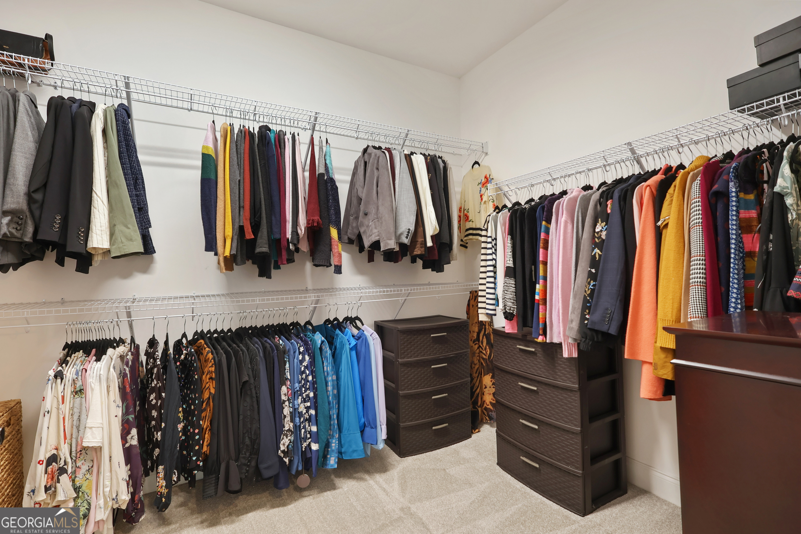 89 Claire Road Forsyth, GA 31029 - Photo 24 of 40 a view of walk in closet with clothes and shoes
