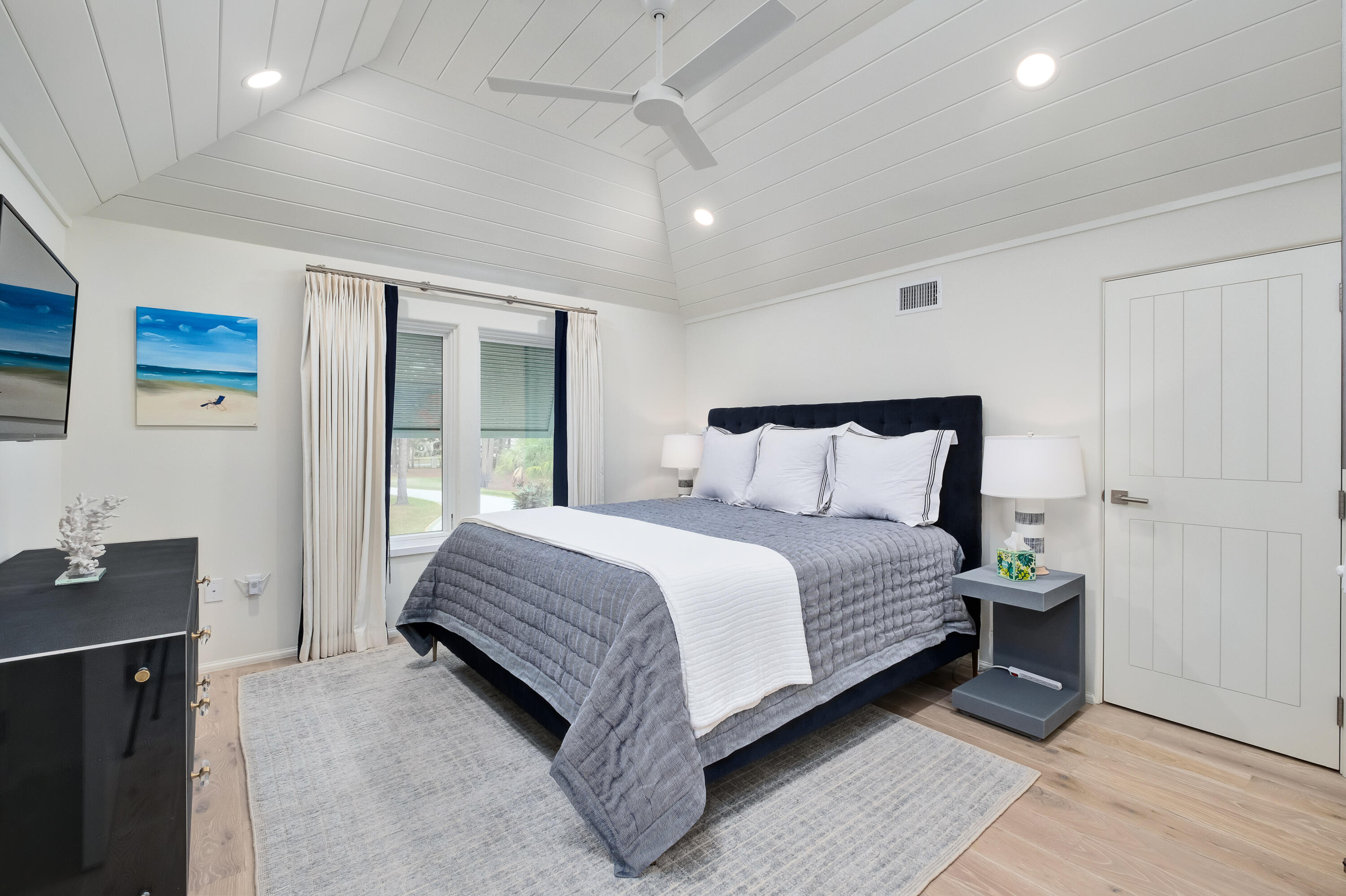 541 Driftwood Point Road Santa Rosa Beach, FL 32459 - Photo 54 of 79 a spacious bedroom with a bed and wooden floor