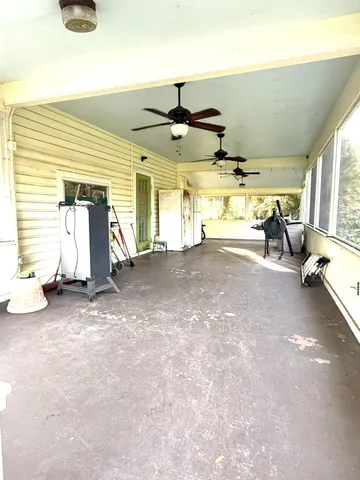 a view of a livingroom with furniture and a window