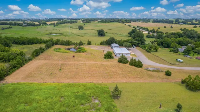 a view of a swimming pool with an outdoor space and seating area