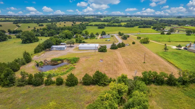 a view of a lake with a yard