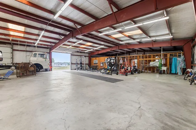 a view of parking garage with cars