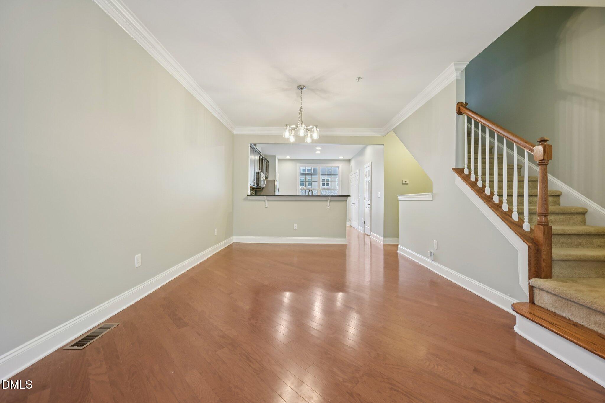 10510 Sablewood Drive, Unit 113 Raleigh, NC 27617 - Photo 8 of 38 a view of an empty room with wooden floor