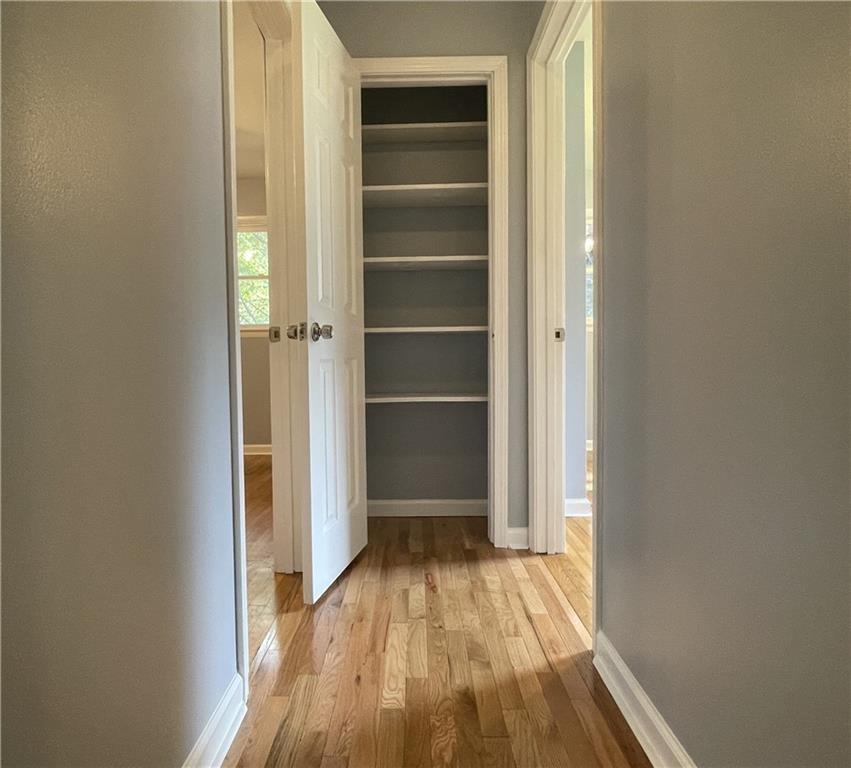 414 Landers Drive Southwest Mableton, GA 30126 - Photo 19 of 44 a view of empty room with wooden floor