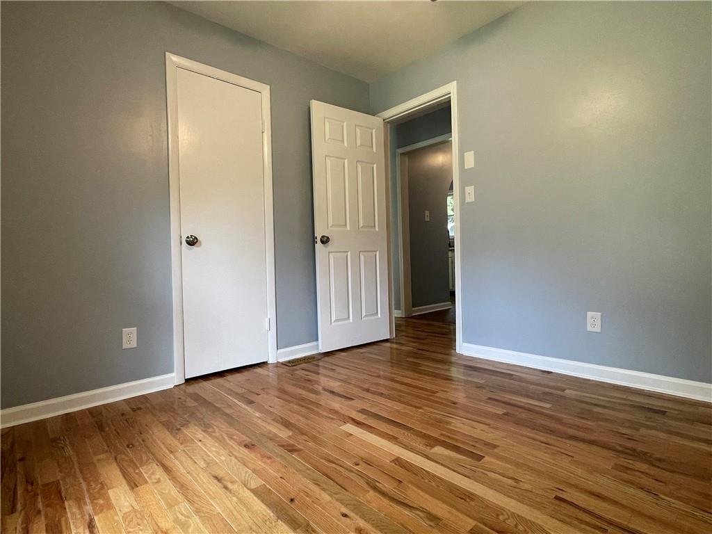 414 Landers Drive Southwest Mableton, GA 30126 - Photo 21 of 44 a view of an empty room with wooden floor and closet