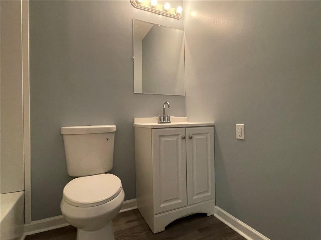 414 Landers Drive Southwest Mableton, GA 30126 - Photo 26 of 44 a bathroom with a toilet sink and mirror