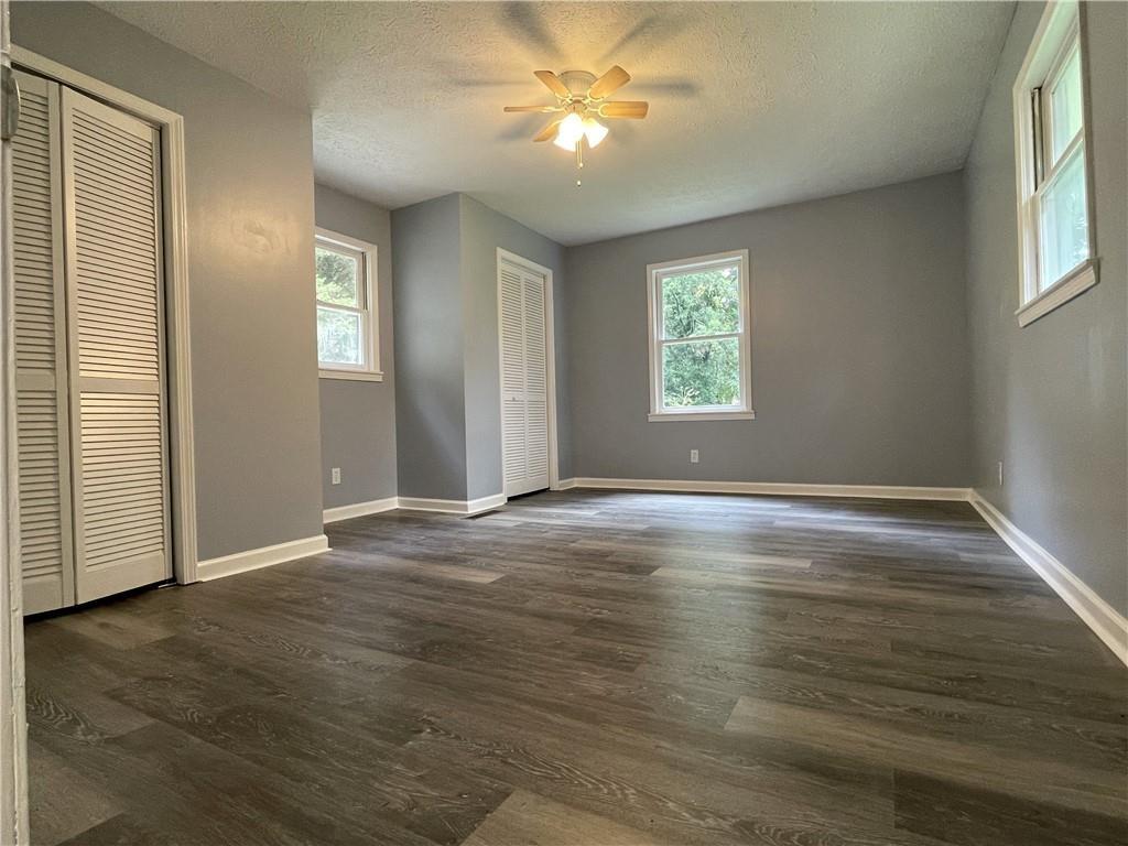 414 Landers Drive Southwest Mableton, GA 30126 - Photo 30 of 44 an empty room with wooden floor and windows