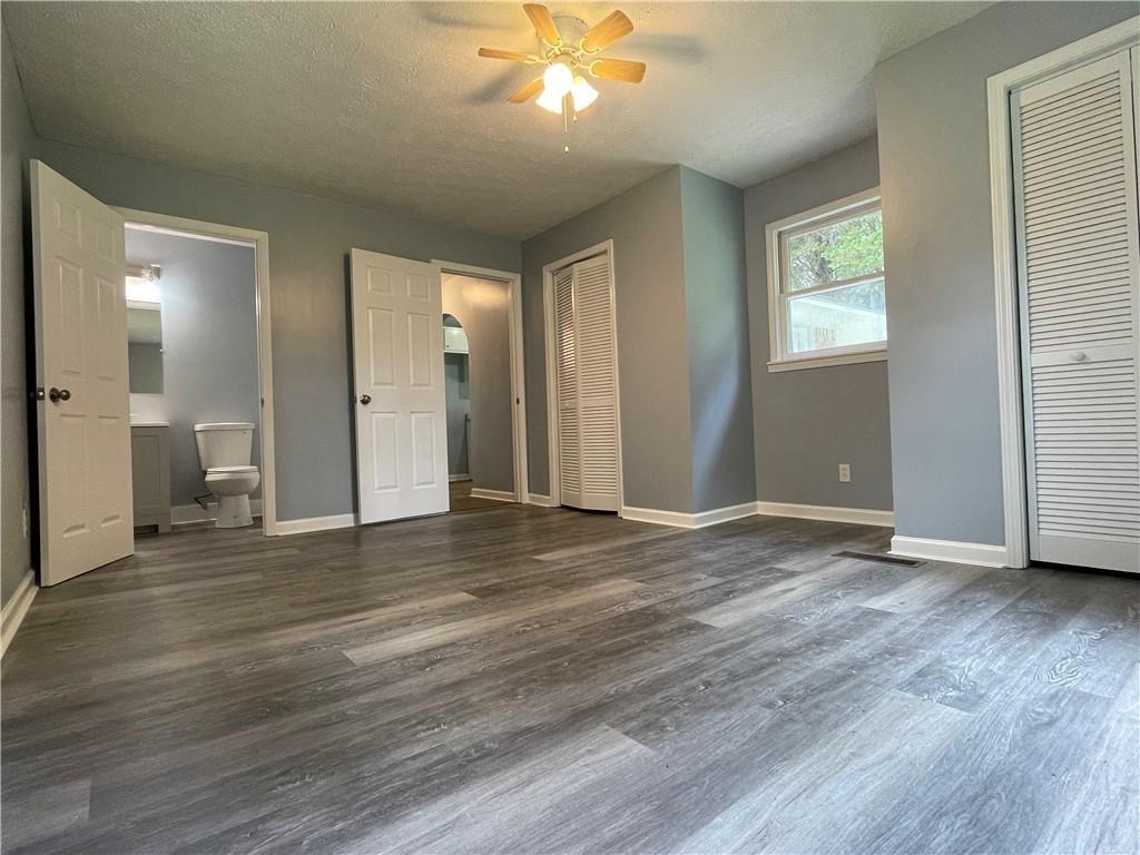 414 Landers Drive Southwest Mableton, GA 30126 - Photo 31 of 44 a view of an empty room with wooden floor and a window