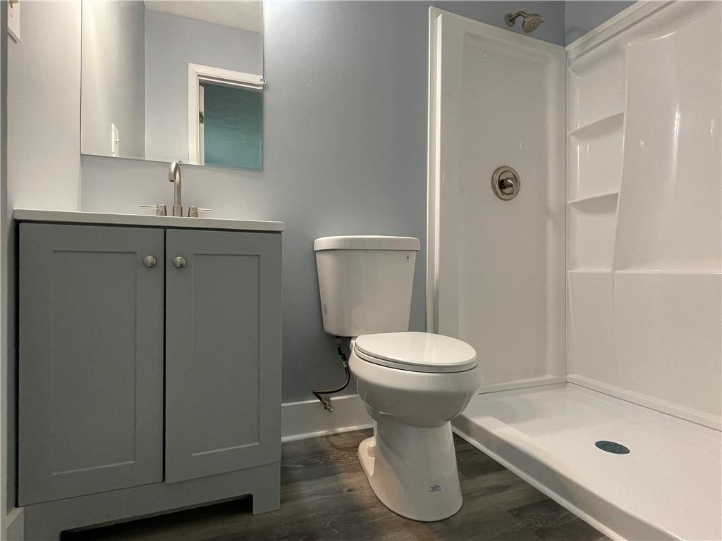 414 Landers Drive Southwest Mableton, GA 30126 - Photo 32 of 44 a bathroom with a sink and a mirror