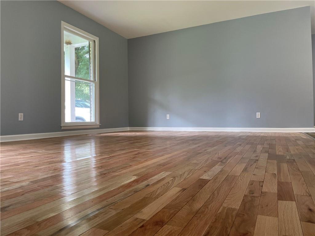 414 Landers Drive Southwest Mableton, GA 30126 - Photo 6 of 44 a view of empty room with wooden floor and fan