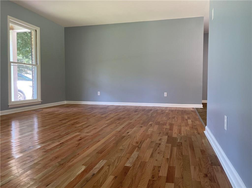 414 Landers Drive Southwest Mableton, GA 30126 - Photo 8 of 44 wooden floor in an empty room with a window
