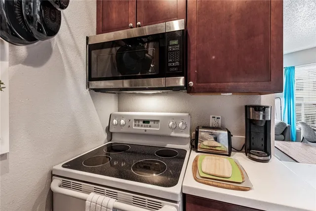 a kitchen with a stove and a microwave