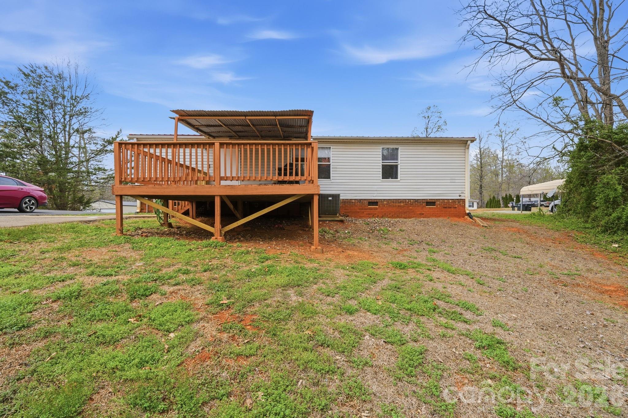 2862 Eagle Point Drive Trinity, NC 27370 - Photo 25 of 31 a backyard of a house with yard and trampoline