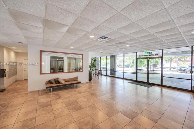 a bathroom with a sink and a large window