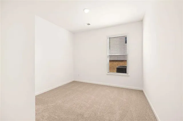 a spacious bathroom with a double vanity sink a mirror and a bathtub