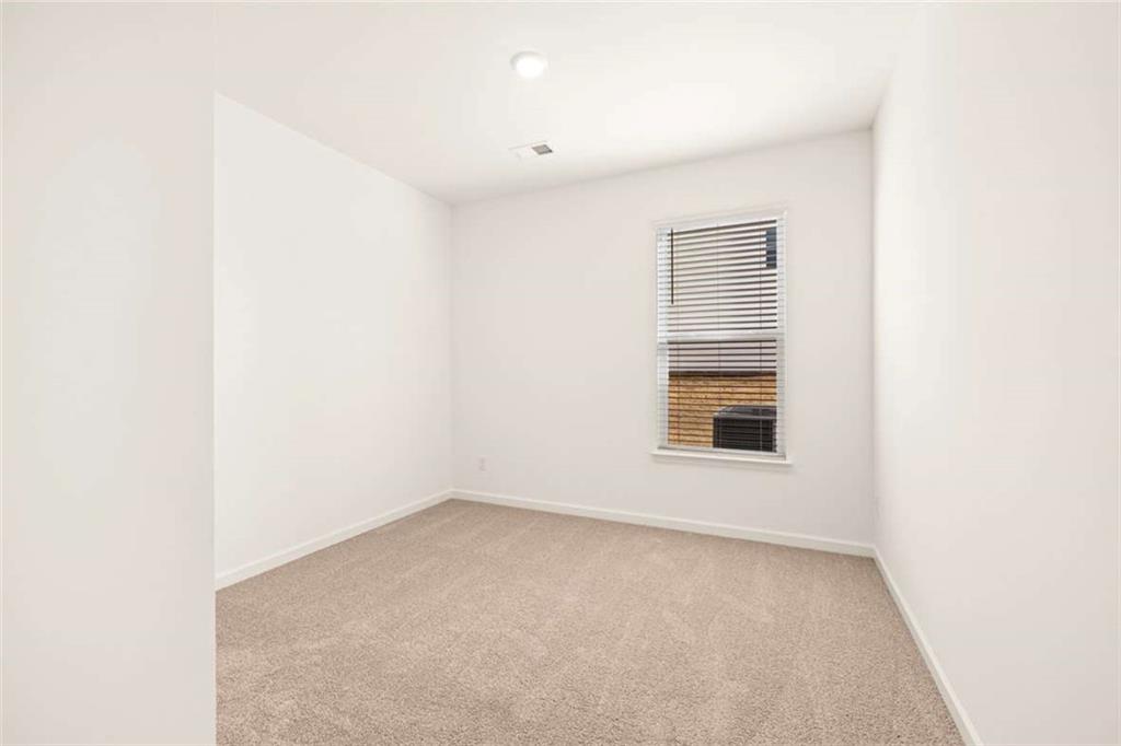 1851 Lacebark Elm Way Lawrenceville, GA 30045 - Photo 27 of 63 an empty room with a window