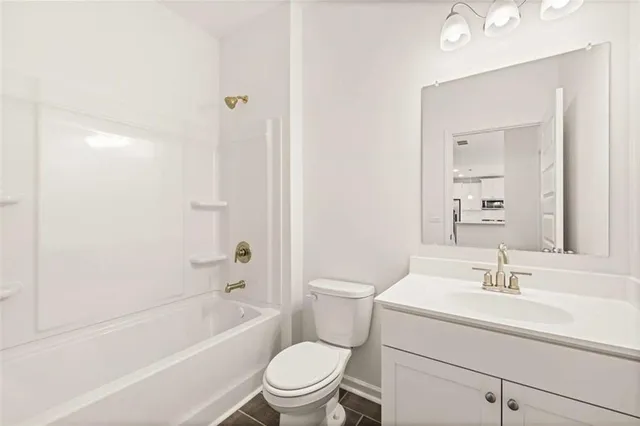 a white bath tub sitting next to a window