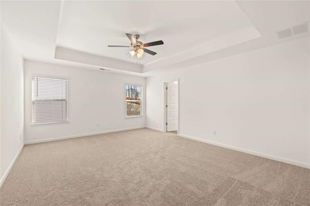 1851 Lacebark Elm Way Lawrenceville, GA 30045 - Photo 32 of 63 a view of an empty room with chandelier fan