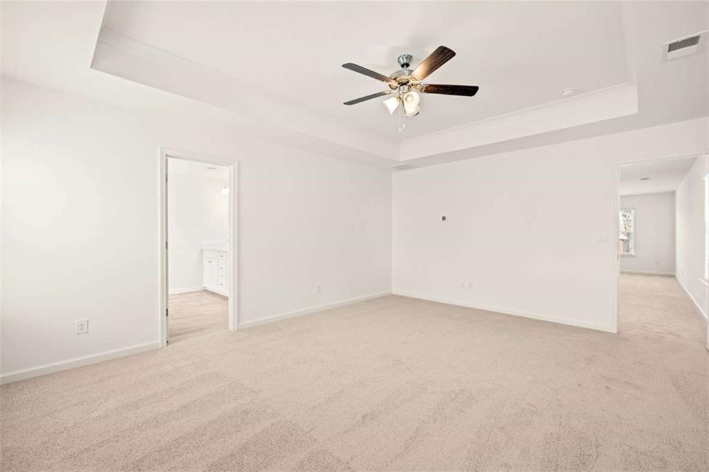1851 Lacebark Elm Way Lawrenceville, GA 30045 - Photo 34 of 63 an empty room with closet and fan