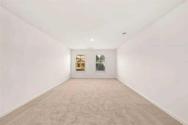 a view of a hallway with washer and dryer