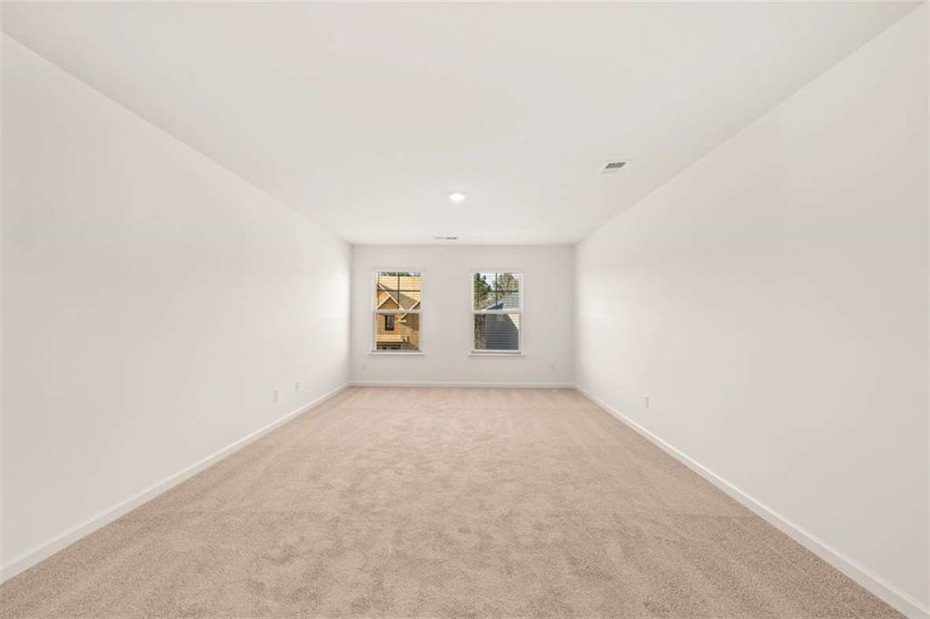 1851 Lacebark Elm Way Lawrenceville, GA 30045 - Photo 40 of 63 an empty room with windows