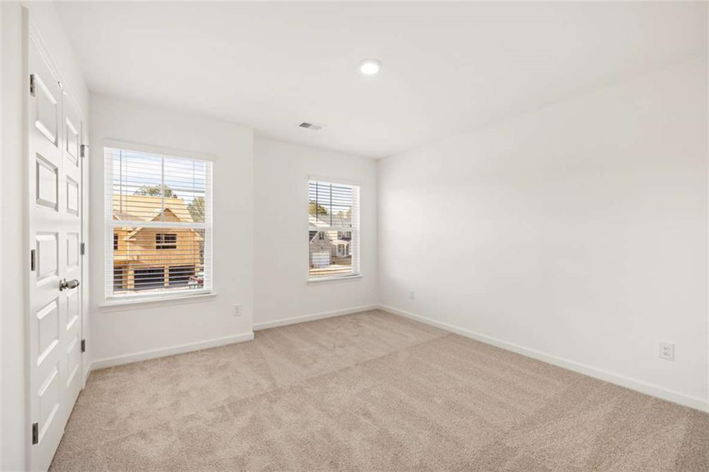 1851 Lacebark Elm Way Lawrenceville, GA 30045 - Photo 45 of 63 an empty room with a window