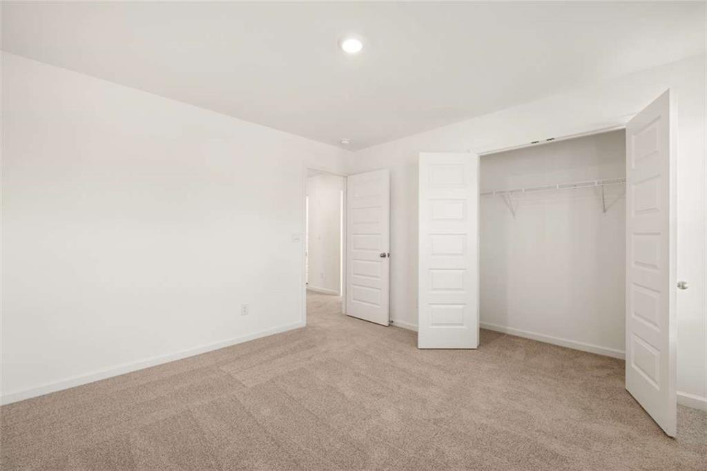 1851 Lacebark Elm Way Lawrenceville, GA 30045 - Photo 46 of 63 an empty room with an empty space