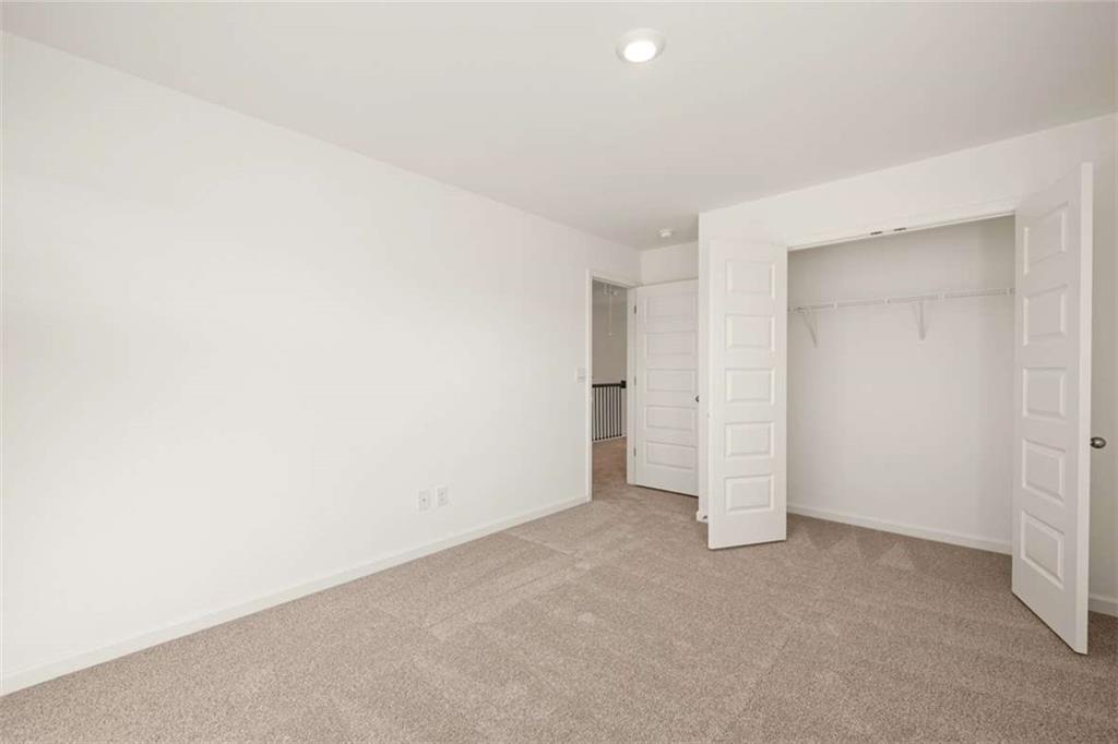 1851 Lacebark Elm Way Lawrenceville, GA 30045 - Photo 48 of 63 a view of an empty room