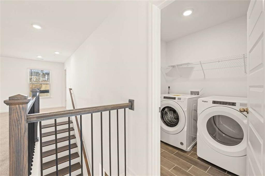 1851 Lacebark Elm Way Lawrenceville, GA 30045 - Photo 53 of 63 a view of a hallway with washer and dryer