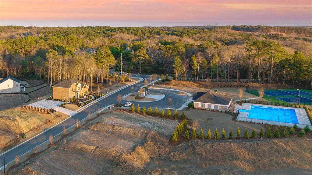 1851 Lacebark Elm Way Lawrenceville, GA 30045 - Photo 58 of 63 a view of a swimming pool with a table and chairs