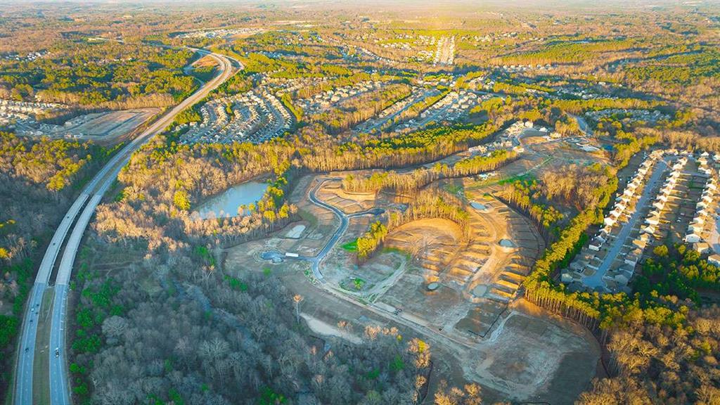 1851 Lacebark Elm Way Lawrenceville, GA 30045 - Photo 60 of 63 an aerial view of residential houses with outdoor space and trees