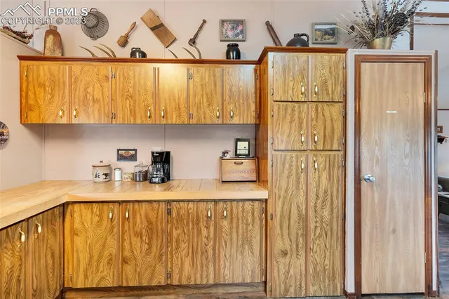 a kitchen with stainless steel appliances granite countertop a refrigerator a sink and a stove