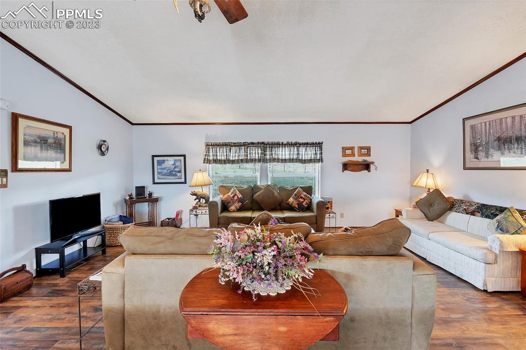 75 6th Street Como, CO 80432 - Photo 20 of 35 a living room with furniture and a flat screen tv