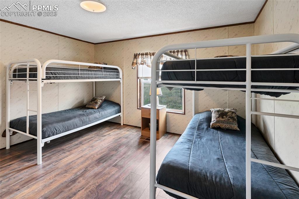 75 6th Street Como, CO 80432 - Photo 25 of 35 a bedroom with furniture and a window