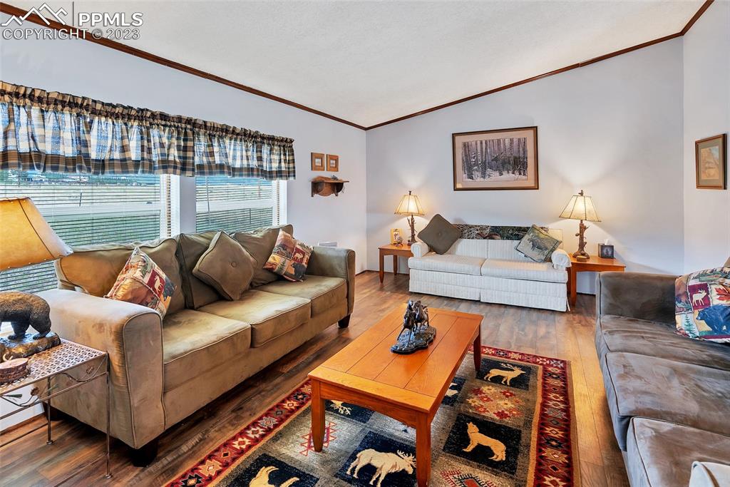 75 6th Street Como, CO 80432 - Photo 28 of 35 a living room with furniture and a floor to ceiling window