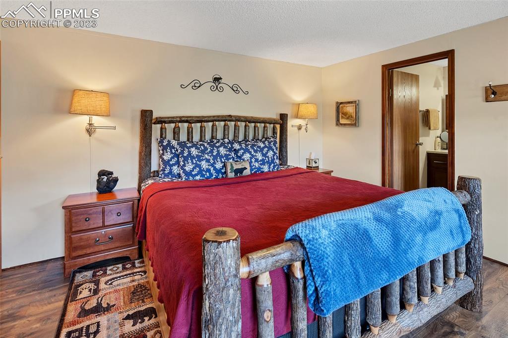 75 6th Street Como, CO 80432 - Photo 30 of 35 a bed sitting in a bedroom next to a window