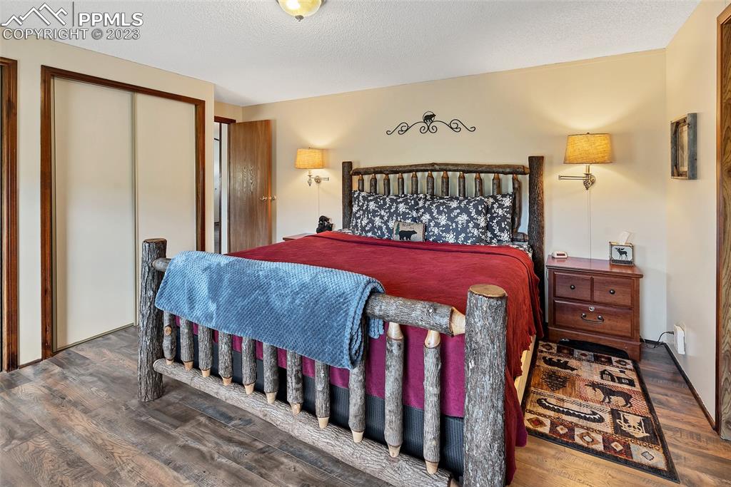 75 6th Street Como, CO 80432 - Photo 31 of 35 a bedroom with a bed and a baby crib
