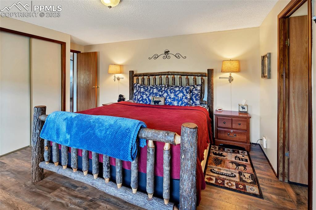 75 6th Street Como, CO 80432 - Photo 32 of 35 a bedroom with a bed and a walk in closet