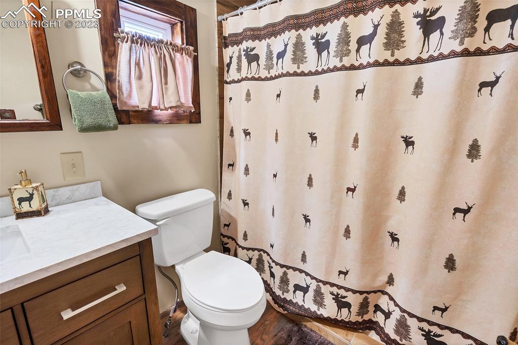 75 6th Street Como, CO 80432 - Photo 33 of 35 a white toilet sitting next to a bathroom sink