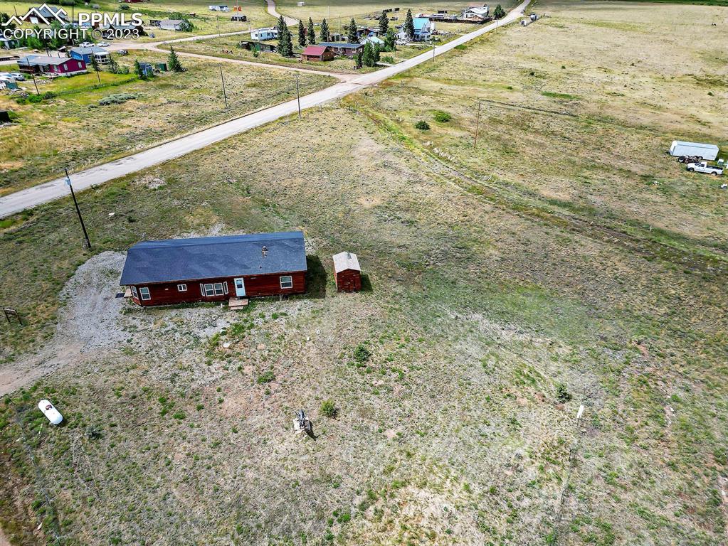 75 6th Street Como, CO 80432 - Photo 34 of 35 a view of a yard with an outdoor space