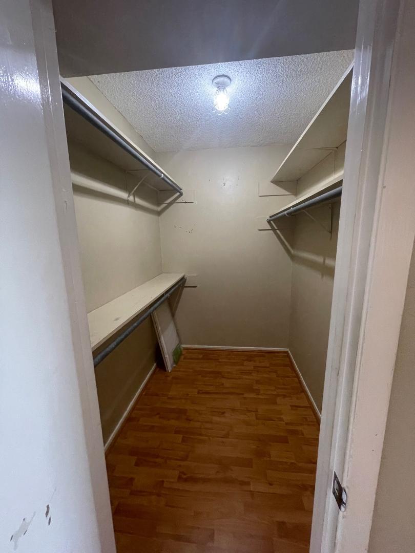 910 Duncan Lane, Unit 44 Austin, TX 78705 - Photo 12 of 15 Ample shelving and hanging space defines this practical closet, perfect for organization.
