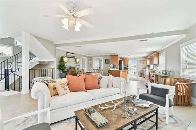 a view of a dining room with furniture and chandelier