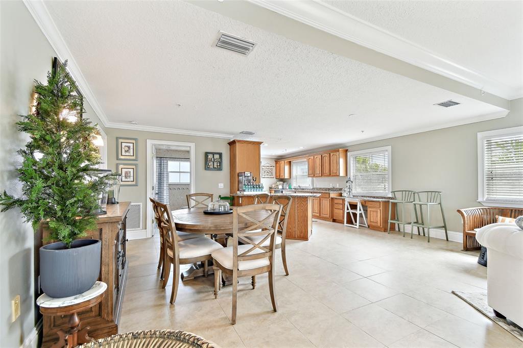 16033 Gulf Boulevard Redington Beach, FL 33708 - Photo 12 of 98 a dining room with furniture and wooden floor