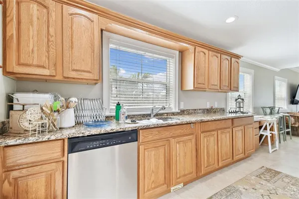 a view of a chair and table in the balcony
