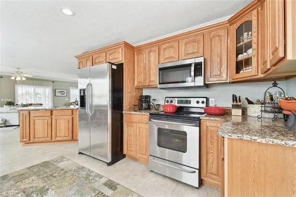 a view of a dining room with furniture wooden floor and a chandelier