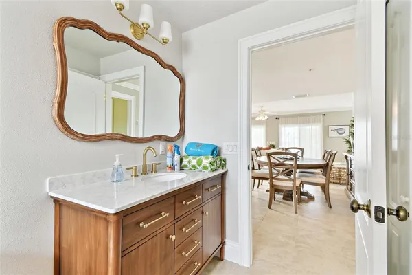 a bedroom with a bed and a lamp